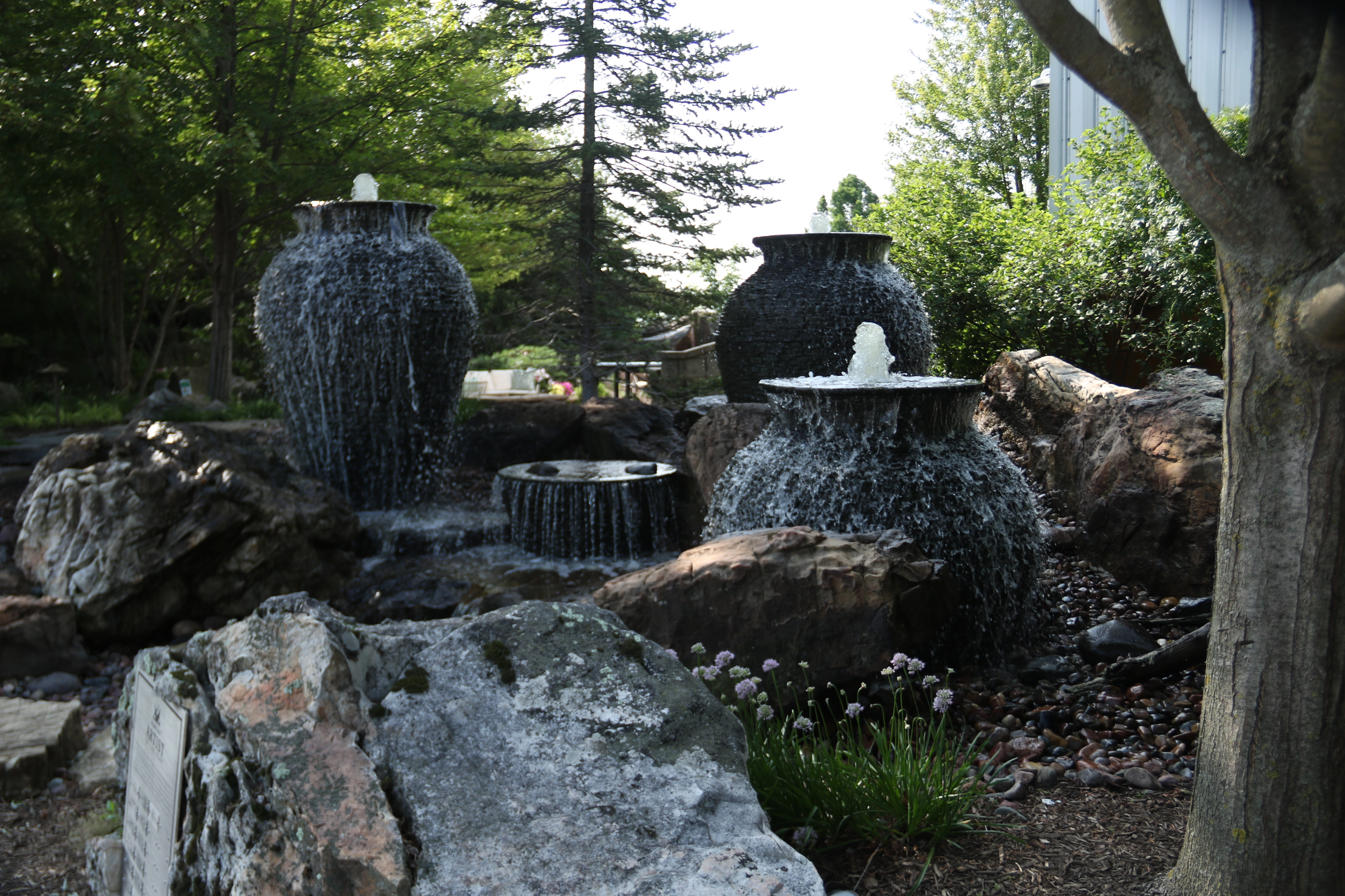Large custom fountainscape with boulders and flowing water in Belle Plaine Minnesota