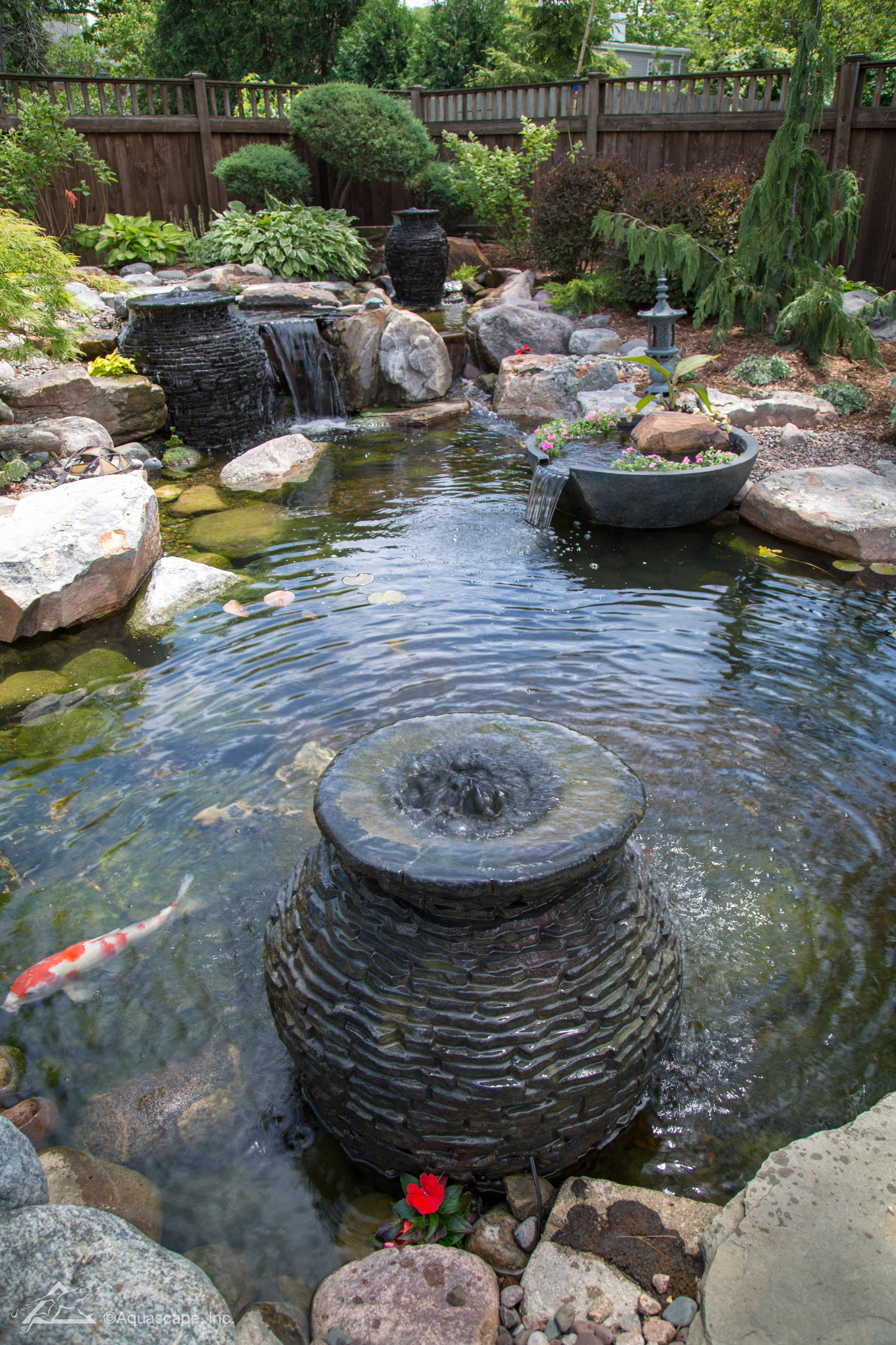 Fountain bowl add-on in a backyard pond in Bloomington Minnesota