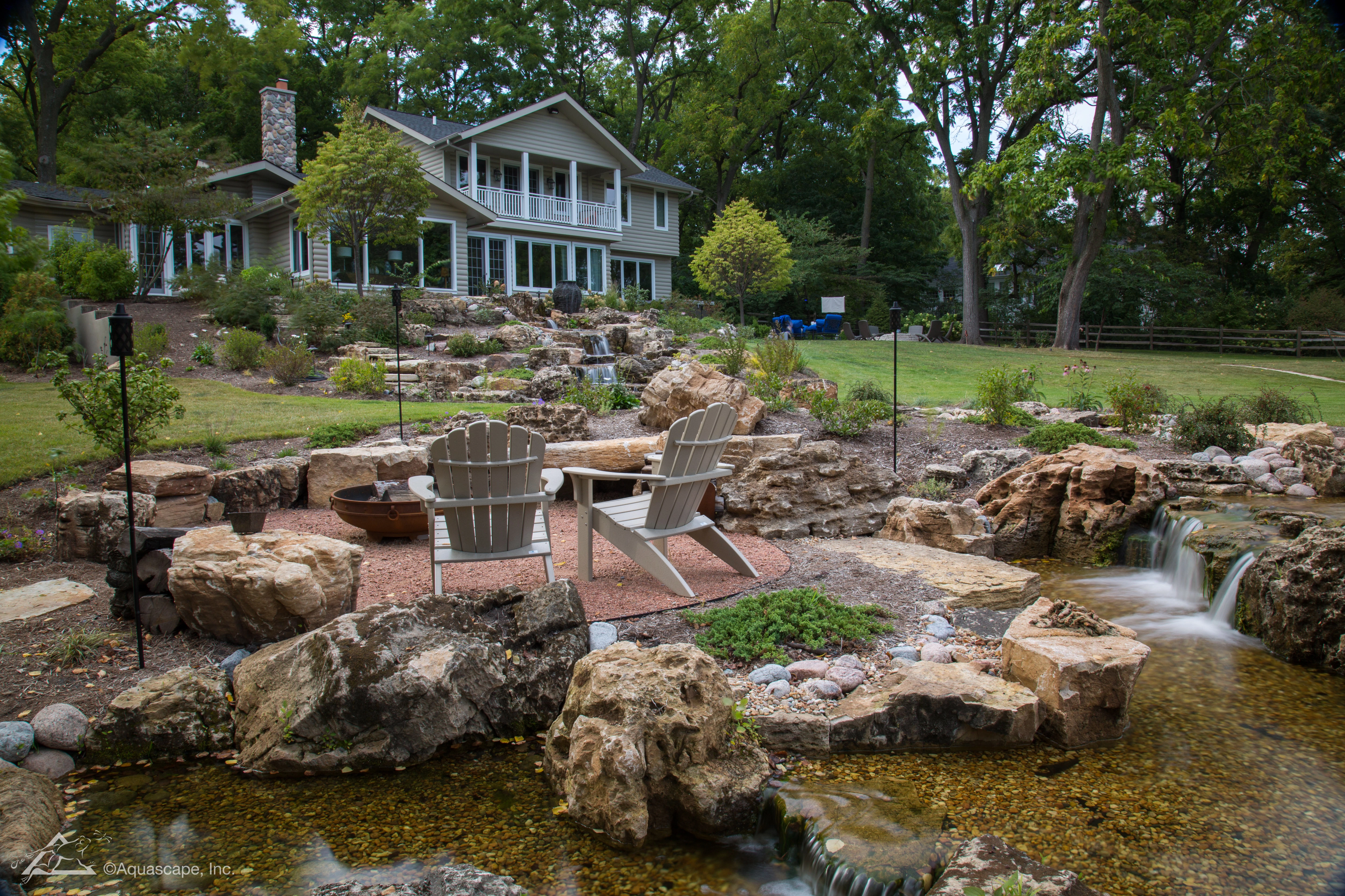 Natural waterfall and stream water feature designed for a Chaska Minnesota property