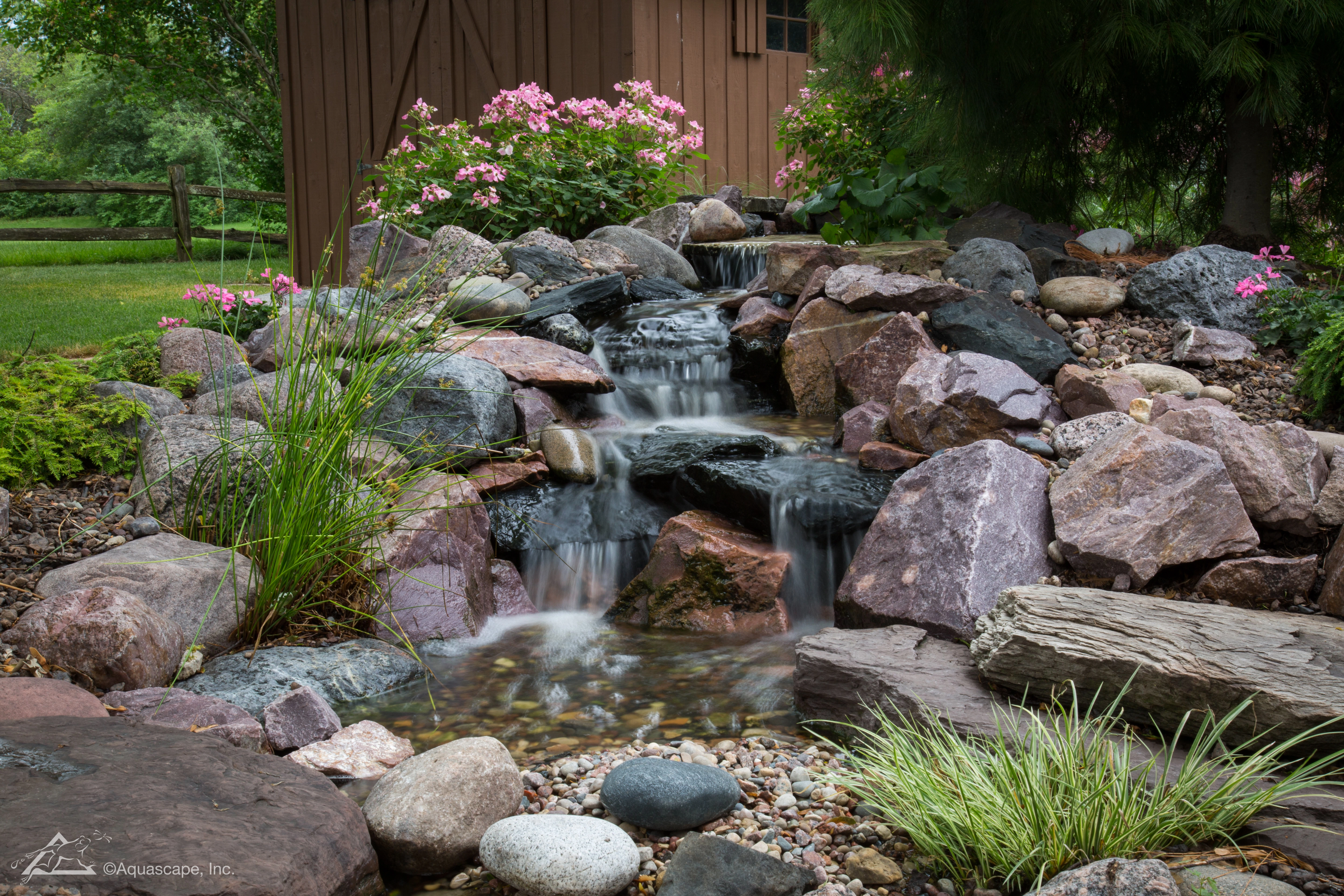 Small pondless waterfall with natural stone in Cottage Grove Minnesota