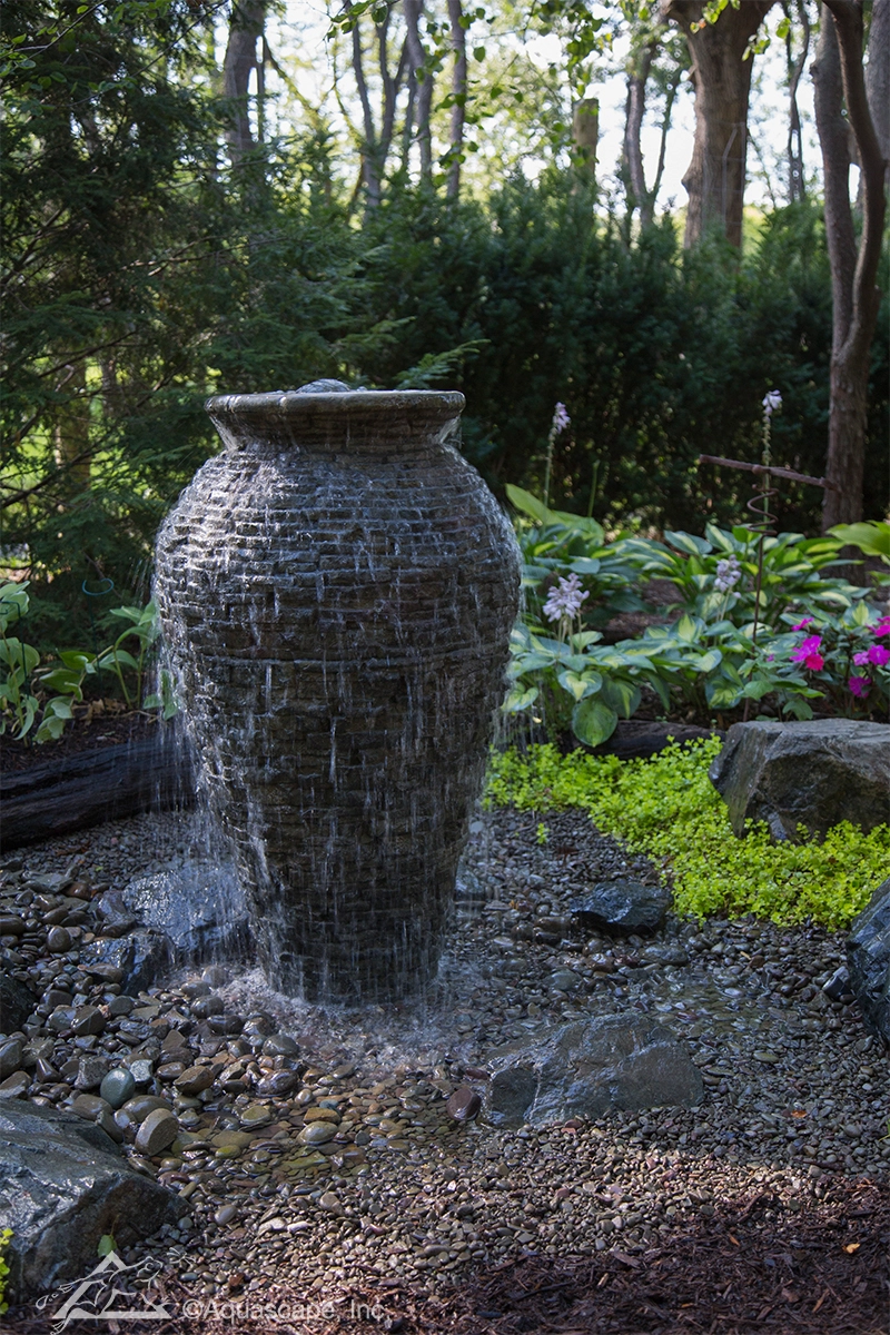 Stacked slate urn fountain in a Cottage Grove landscape
