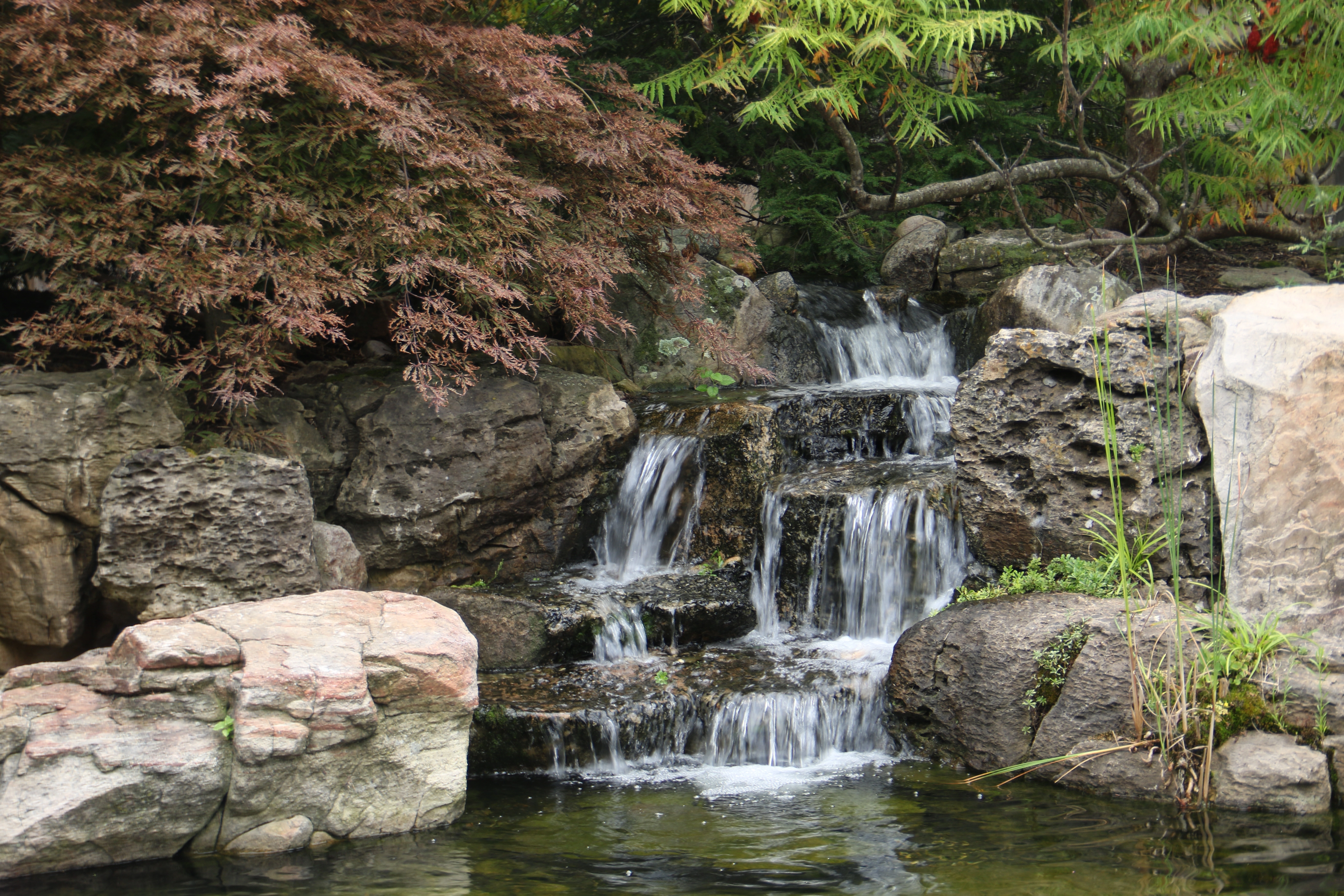 Layered pond waterfalls inspired by Lake Minnetonka outdoor living near Excelsior Minnesota