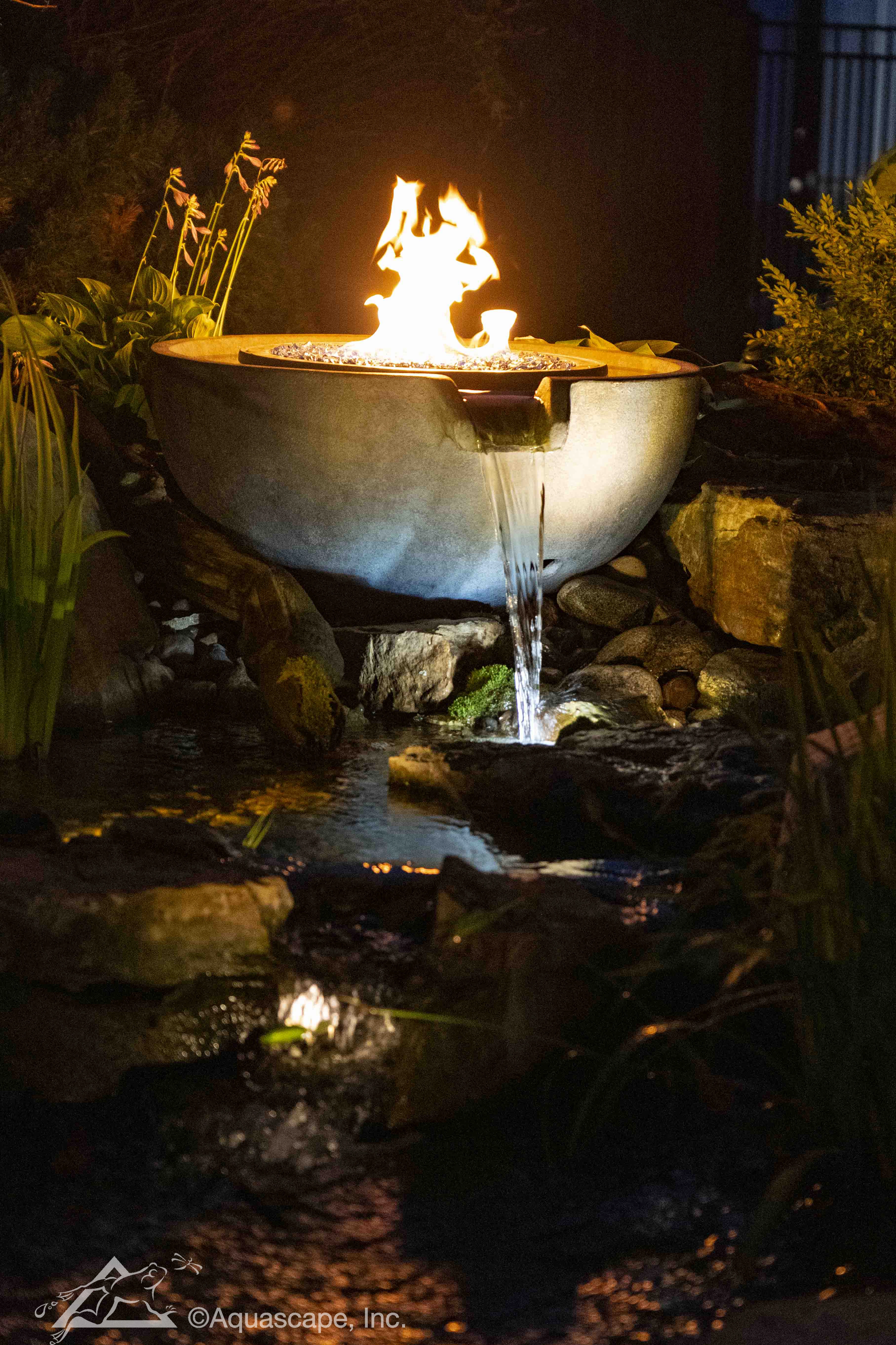 Fire and water spillway bowl feature at night in Fairmont Minnesota