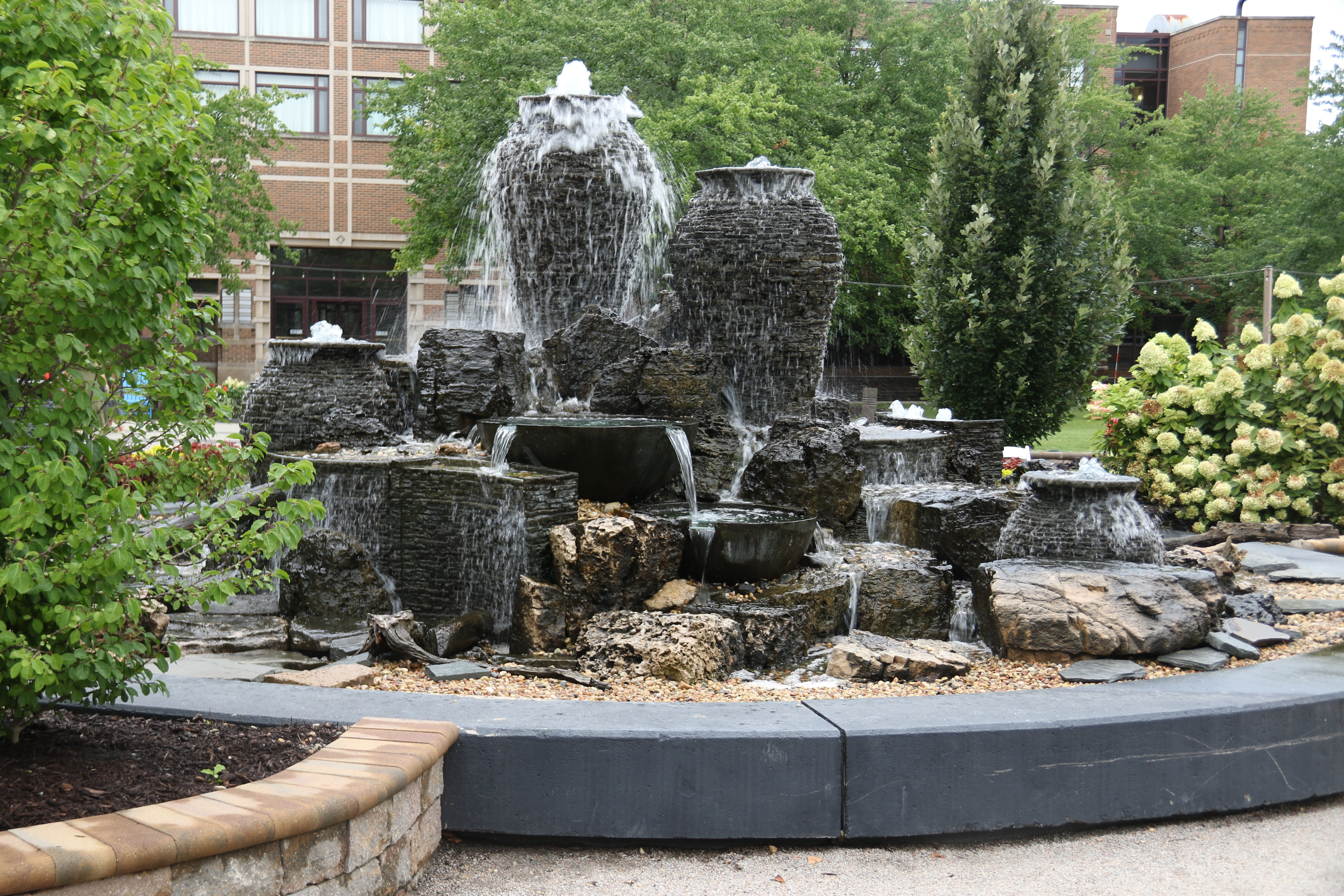 Large decorative fountainscape with multiple urns and flowing water in Jordan Minnesota