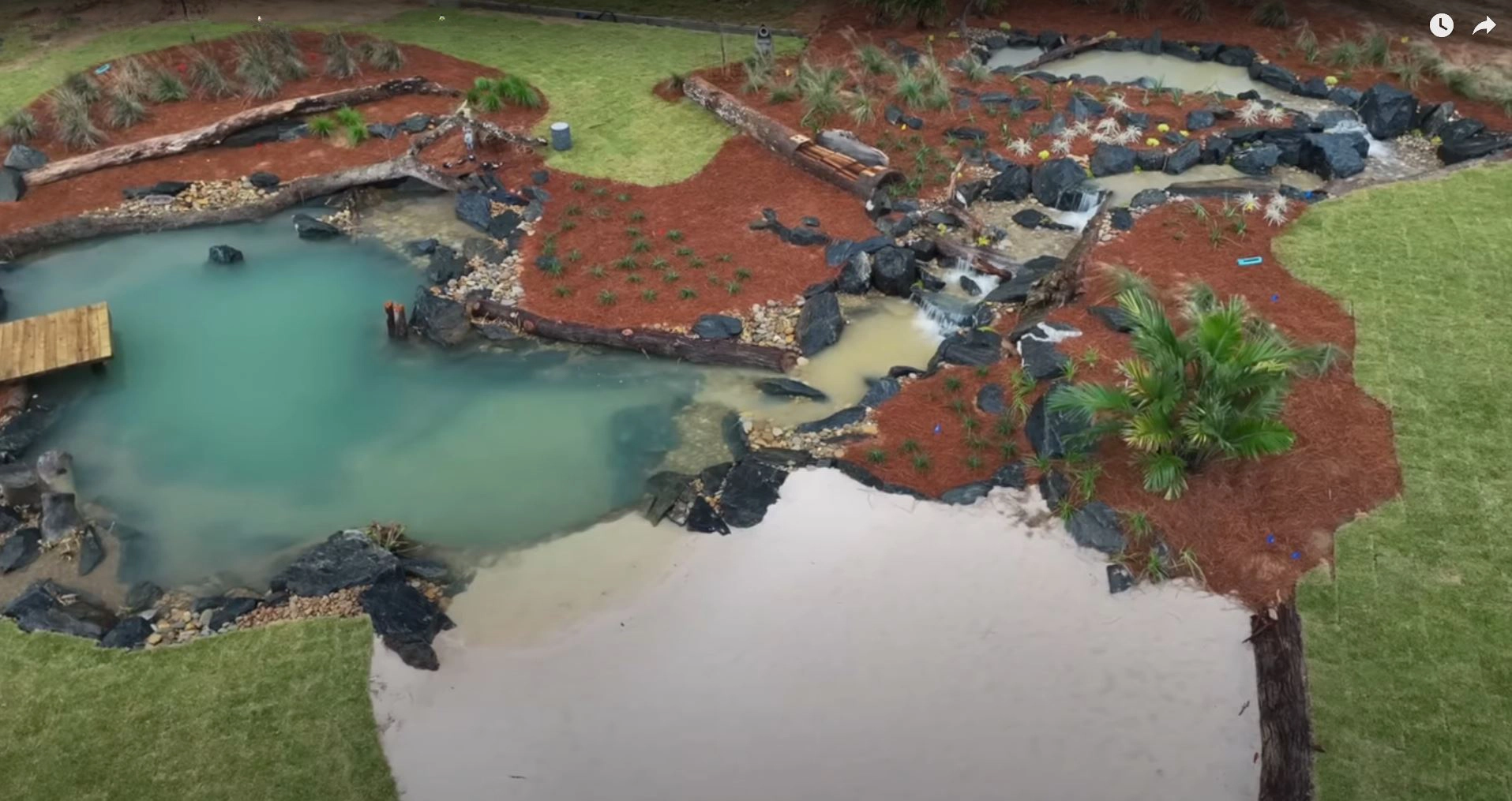 Aerial view of a large ecosystem pond and waterfall construction project in Marshall Minnesota