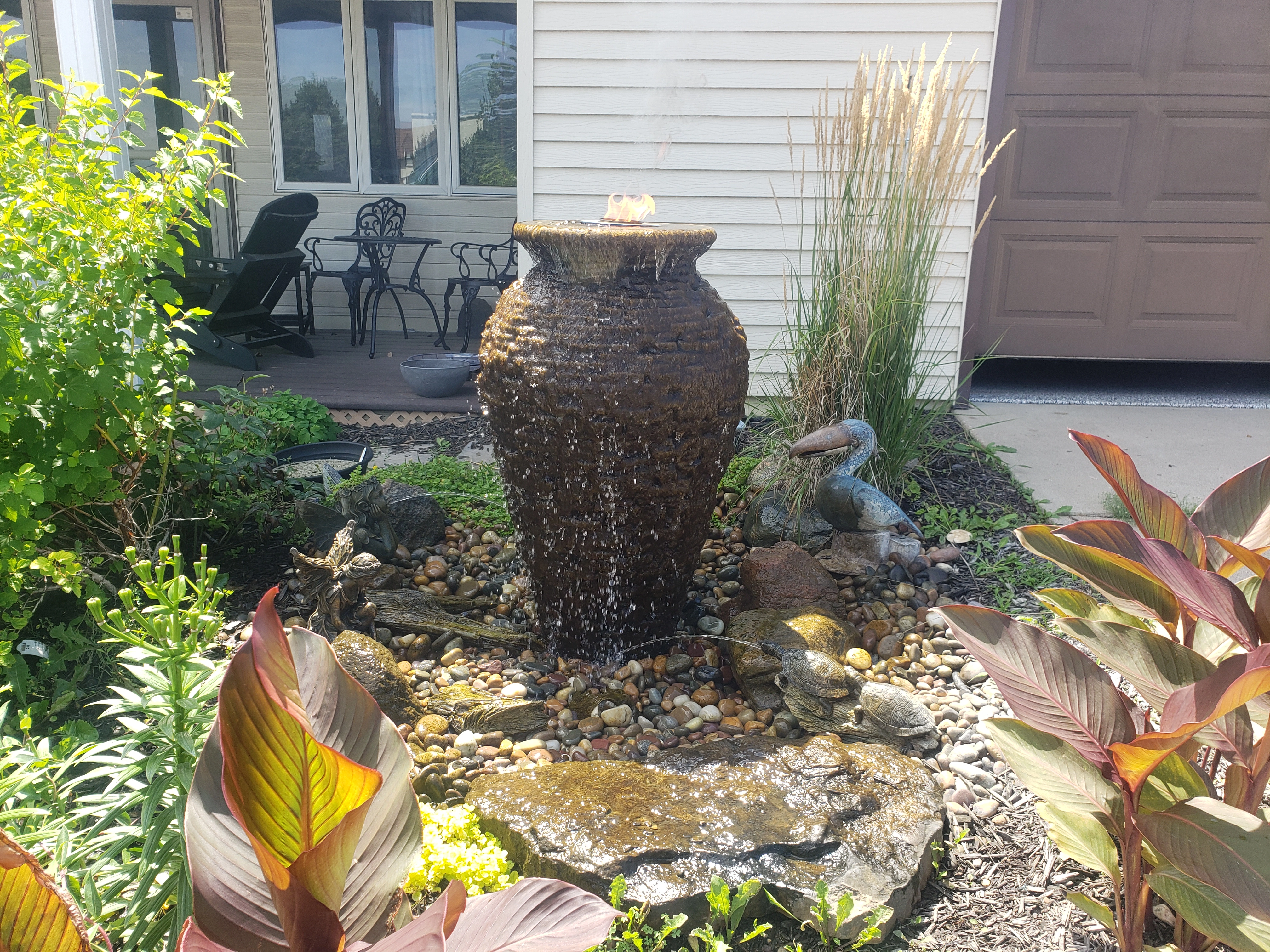 Decorative fountainscape water feature with colorful landscaping in New Ulm Minnesota