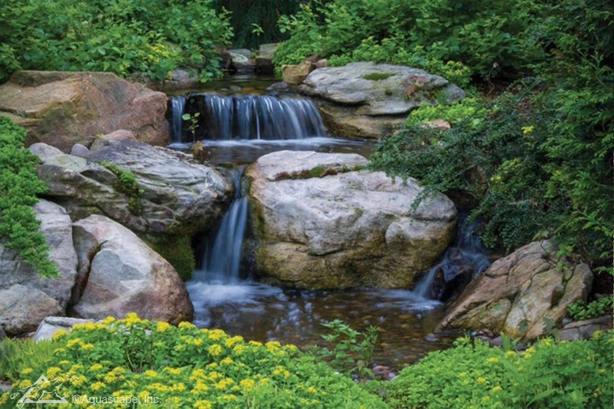 Medium pondless waterfall with natural stone in Rosemount Minnesota