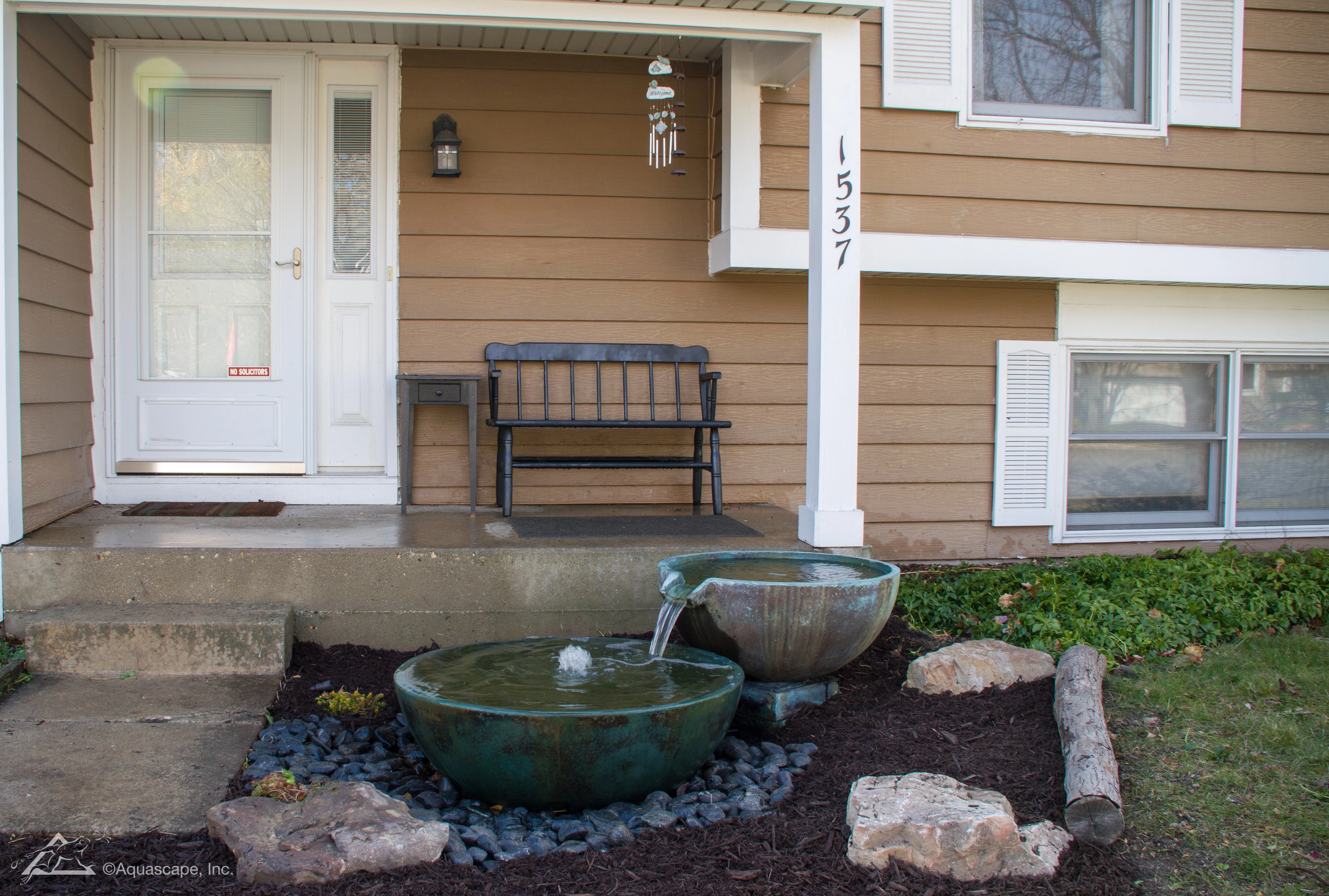 Decorative fountain bowls arranged in a compact outdoor space