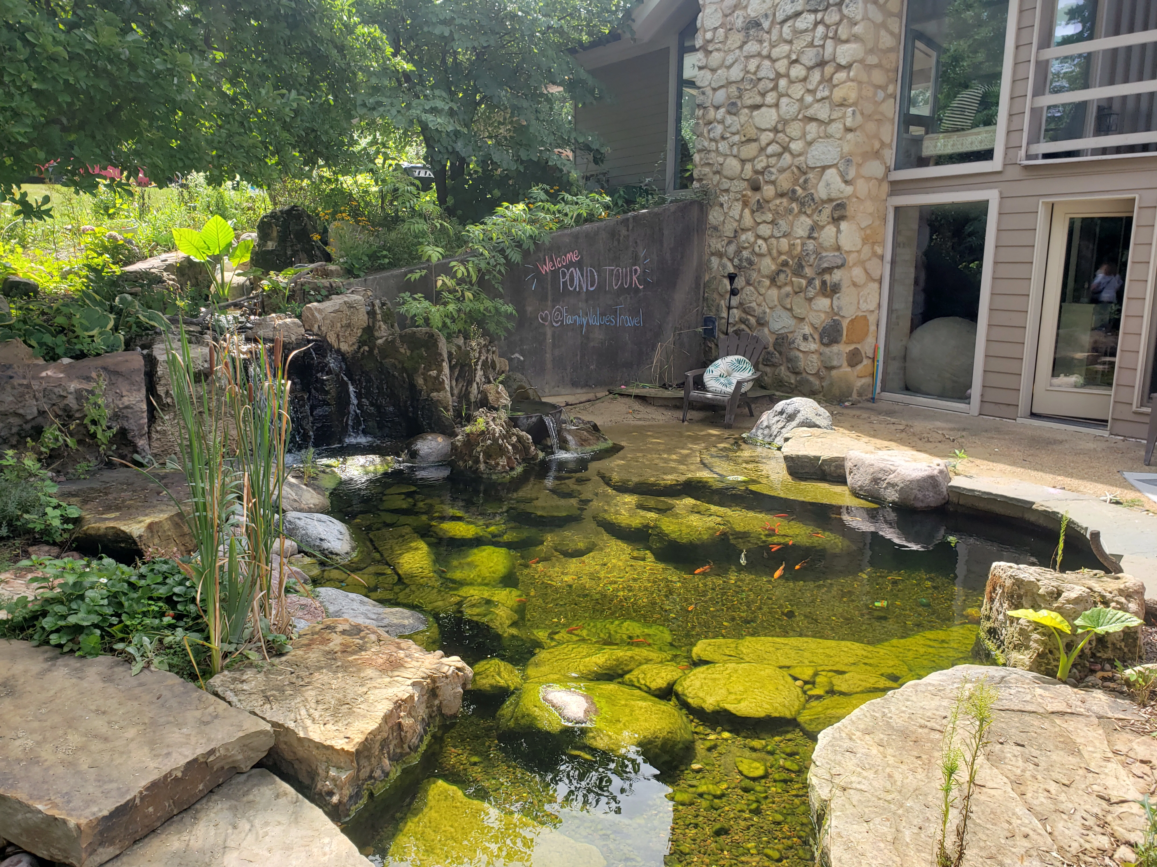 Custom ecosystem pond with natural stone waterfall in Shakopee Minnesota