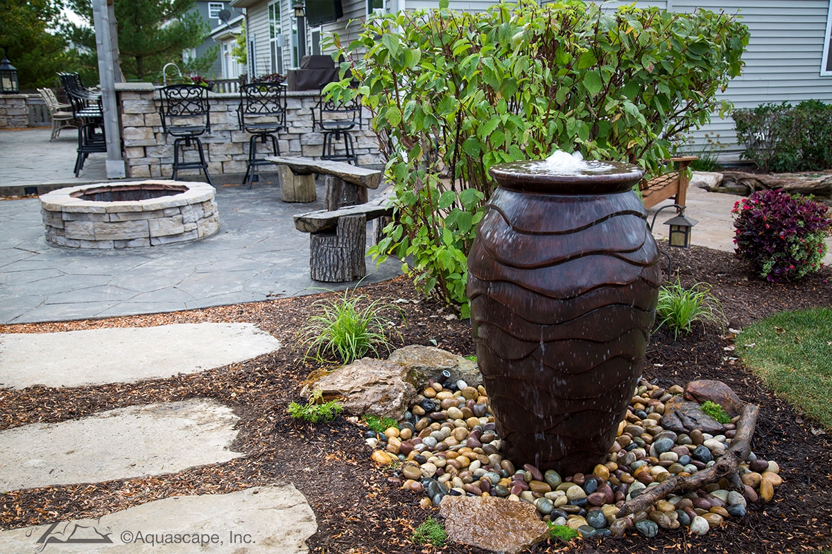 Scalloped urn fountain for a Shorewood Minnesota outdoor living space