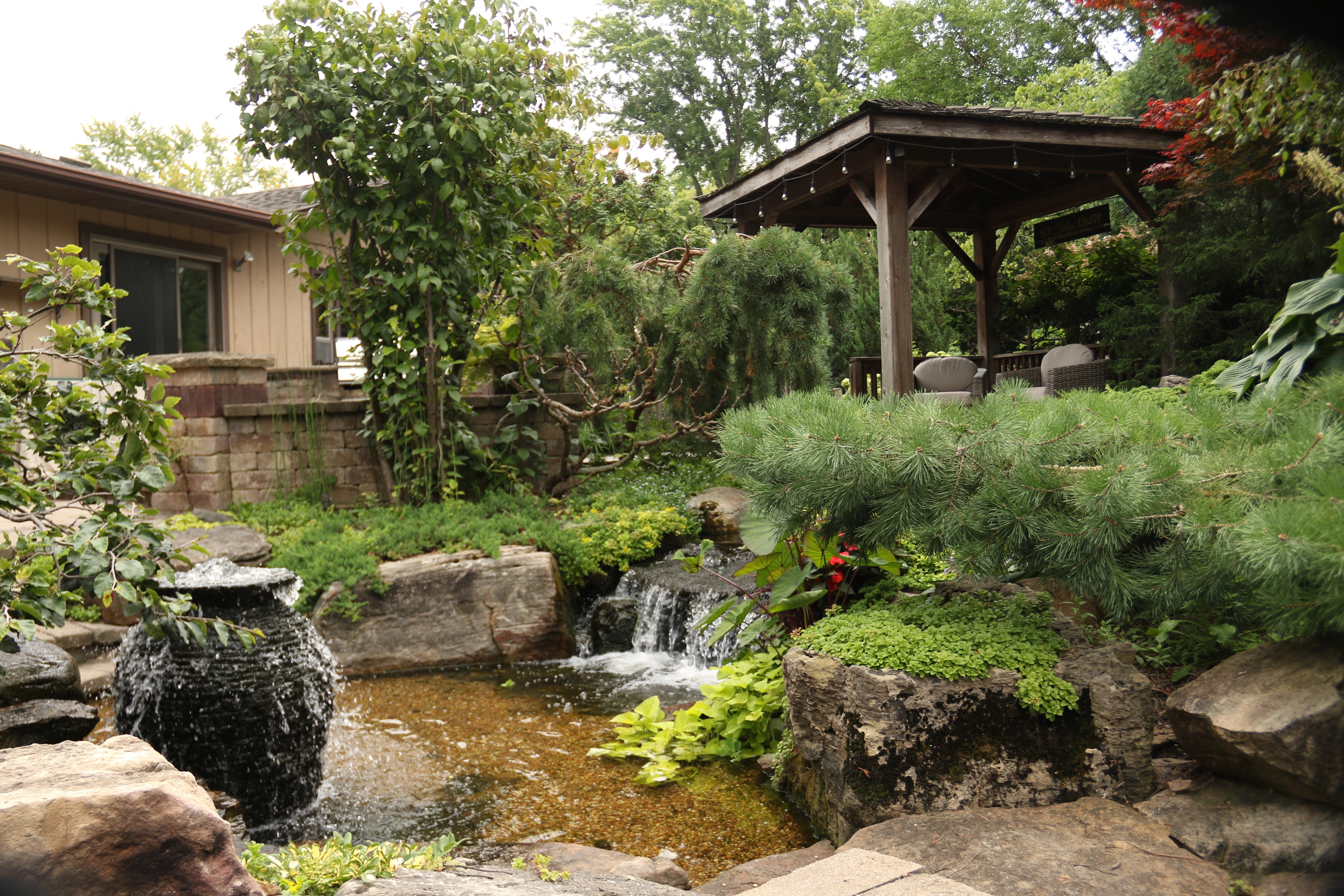 Decorative fountainscape water feature with vibrant landscaping in Minnesota