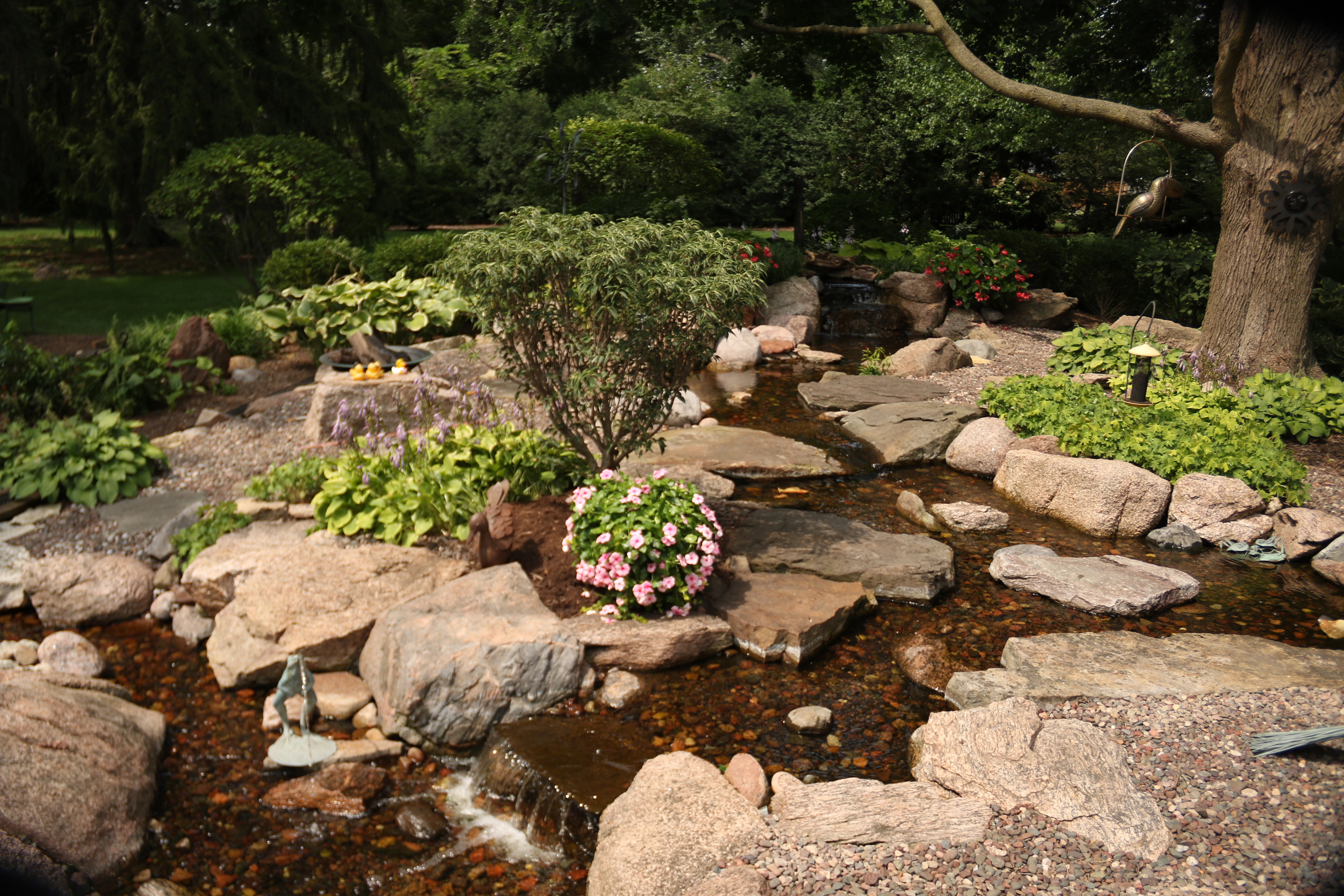 Premium pondless waterfall with natural stream design in Twin Cities Minnesota